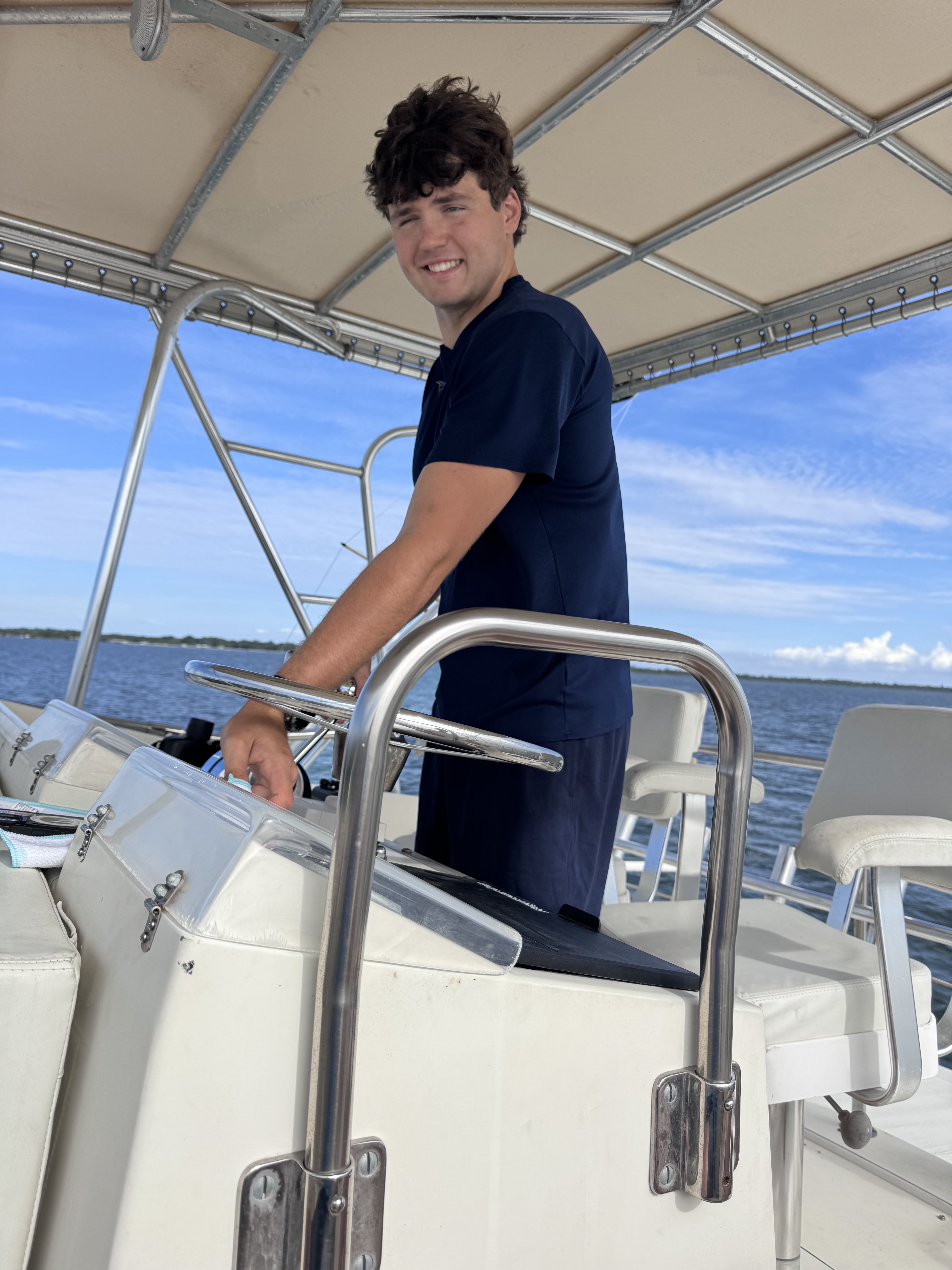 Captain Cole Sieveking at the helm of Ibis Offshore